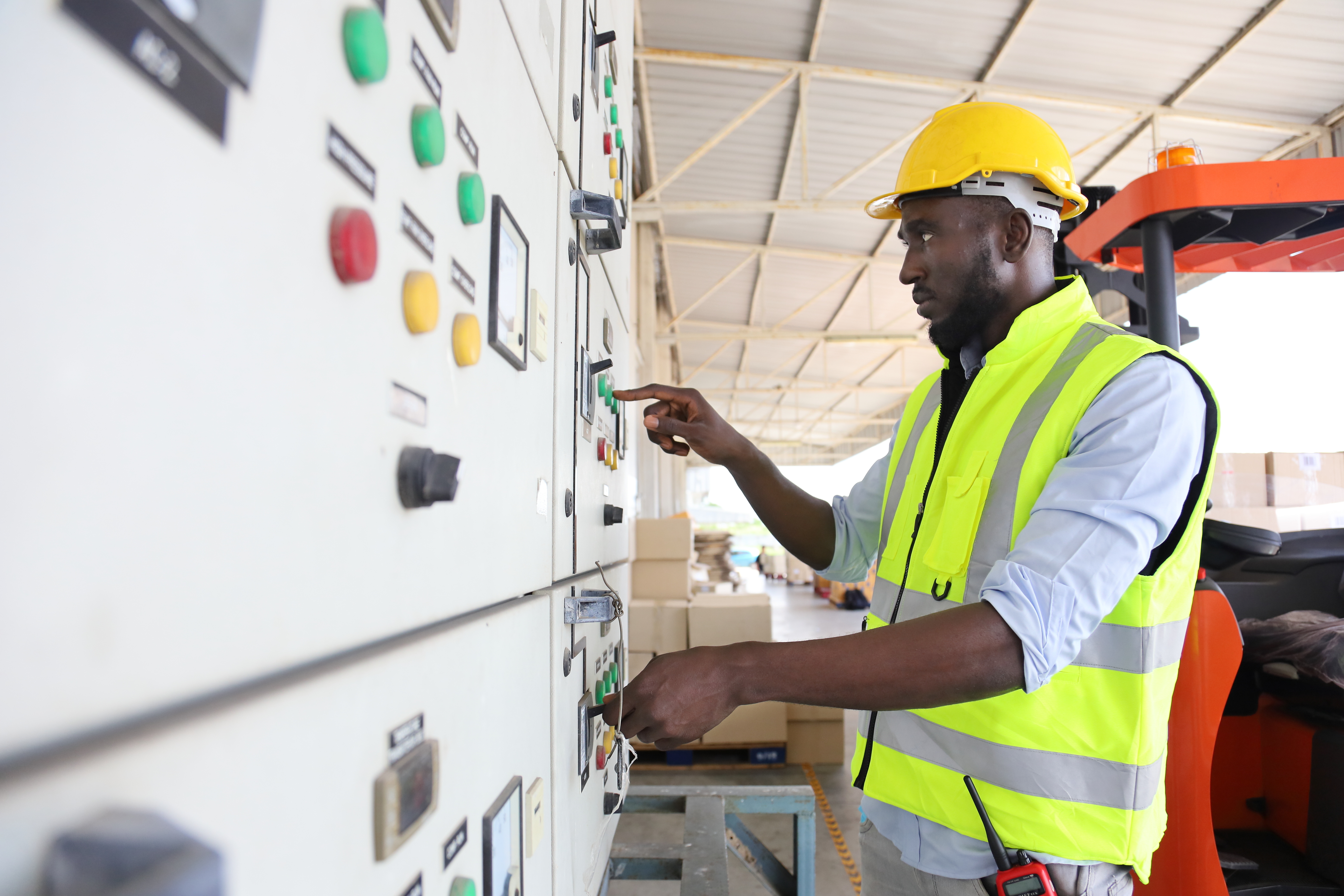 African American engineer is checking for power at main distribu